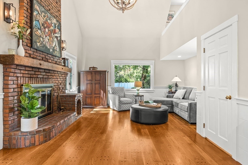 19 Louis Drive Wellesley, MA 02481 - Photo 11 of 30 a living room with furniture a fireplace and a potted plant