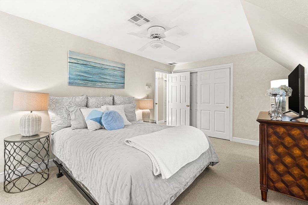 19 Louis Drive Wellesley, MA 02481 - Photo 21 of 30 a bedroom with a bed and a tv on the dresser