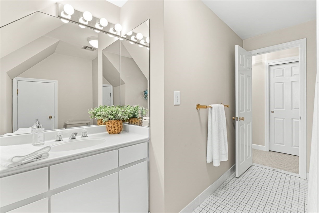 19 Louis Drive Wellesley, MA 02481 - Photo 23 of 30 a bathroom with a sink a mirror and a shower