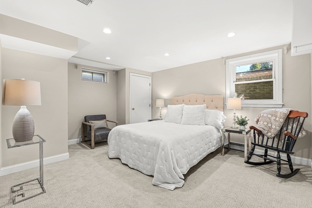 19 Louis Drive Wellesley, MA 02481 - Photo 24 of 30 a spacious bedroom with a bed and a couch