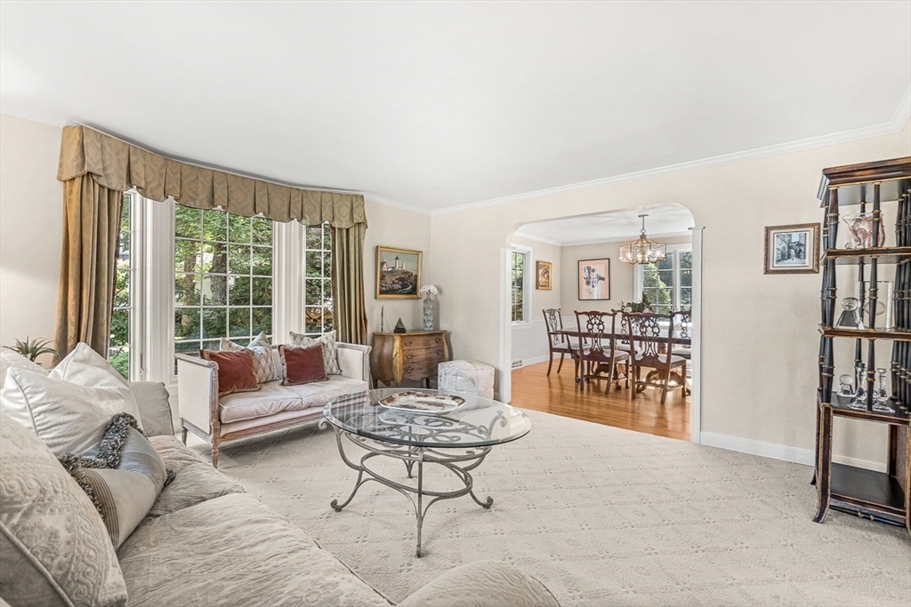 19 Louis Drive Wellesley, MA 02481 - Photo 5 of 30 a living room with furniture and a book shelf