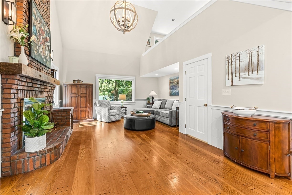 19 Louis Drive Wellesley, MA 02481 - Photo 8 of 30 a living room with furniture and a kitchen