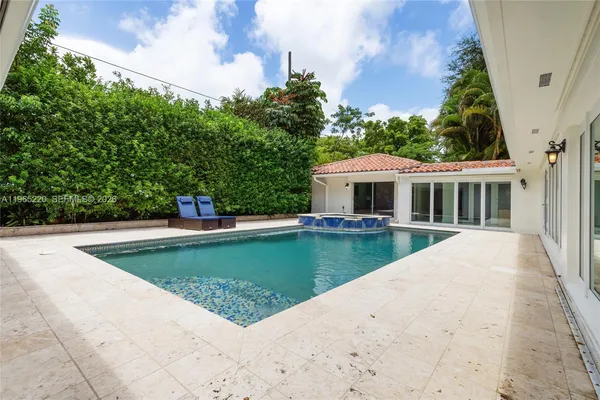 a view of a house with swimming pool