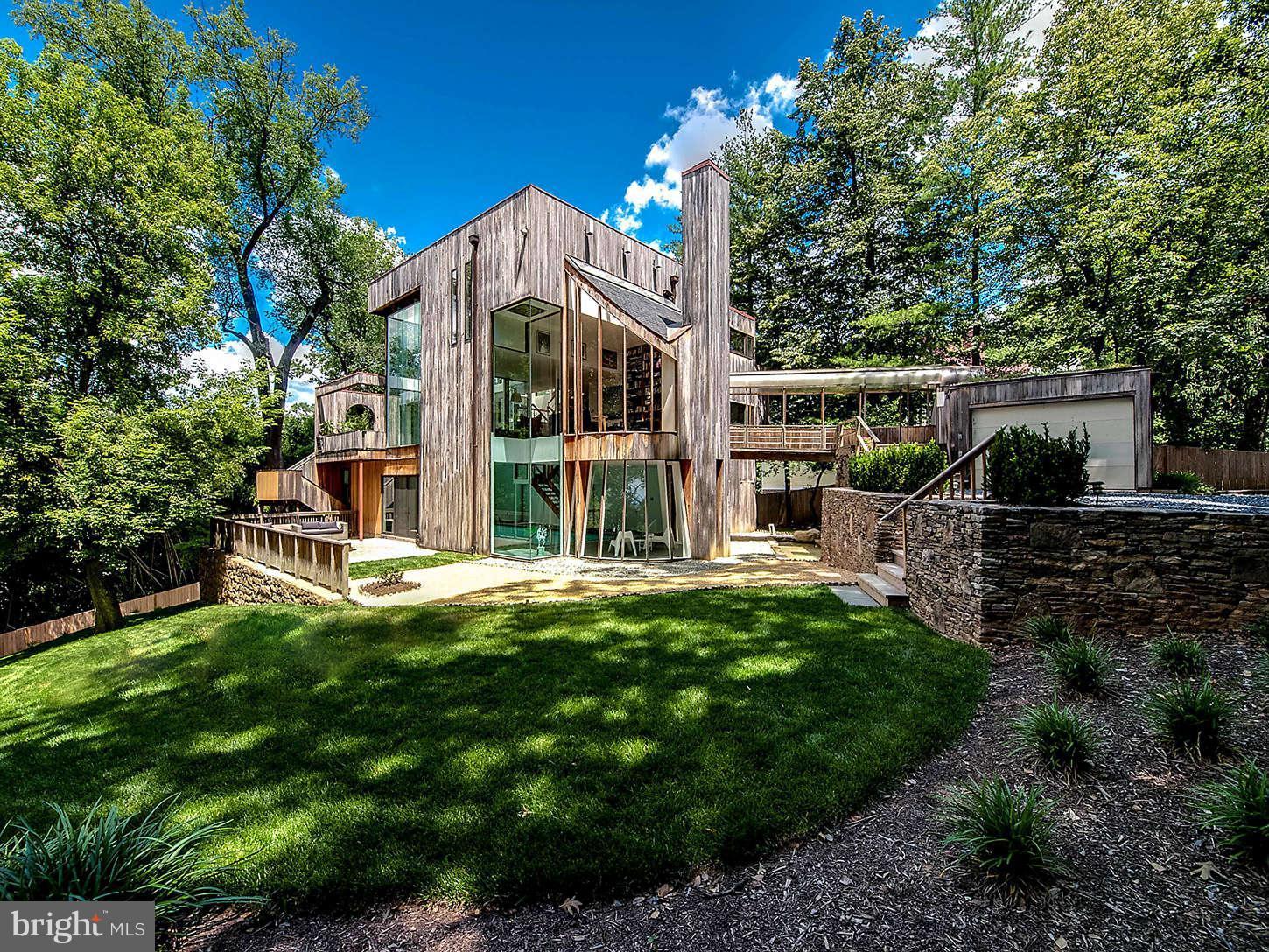 2724 Chain Bridge Road Northwest Washington, DC 20016 - Photo 2 of 30 a view of a house with backyard and sitting area