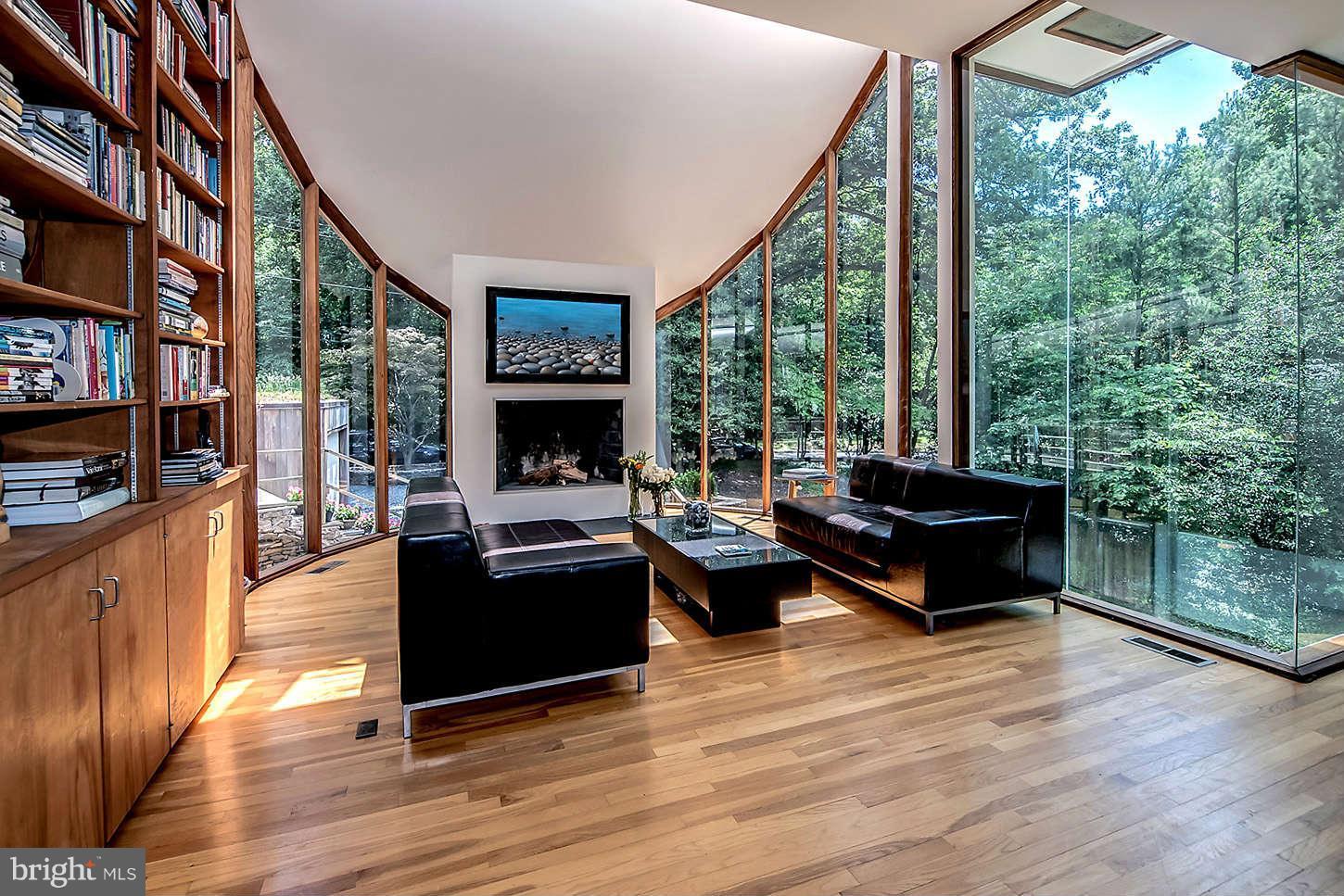 2724 Chain Bridge Road Northwest Washington, DC 20016 - Photo 12 of 30 a living room with furniture a large window and wooden floor