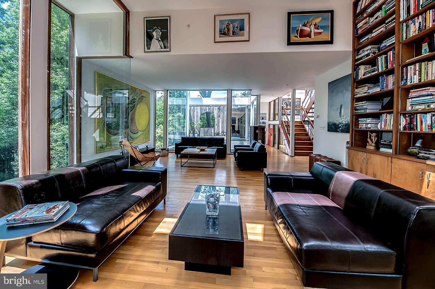 2724 Chain Bridge Road Northwest Washington, DC 20016 - Photo 13 of 30 a living room with furniture and a book shelf