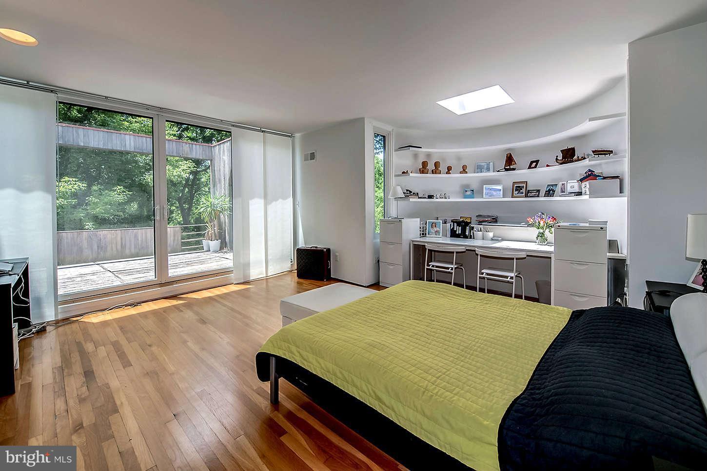 2724 Chain Bridge Road Northwest Washington, DC 20016 - Photo 15 of 30 a large kitchen with kitchen island a large window a sink and stainless steel appliances