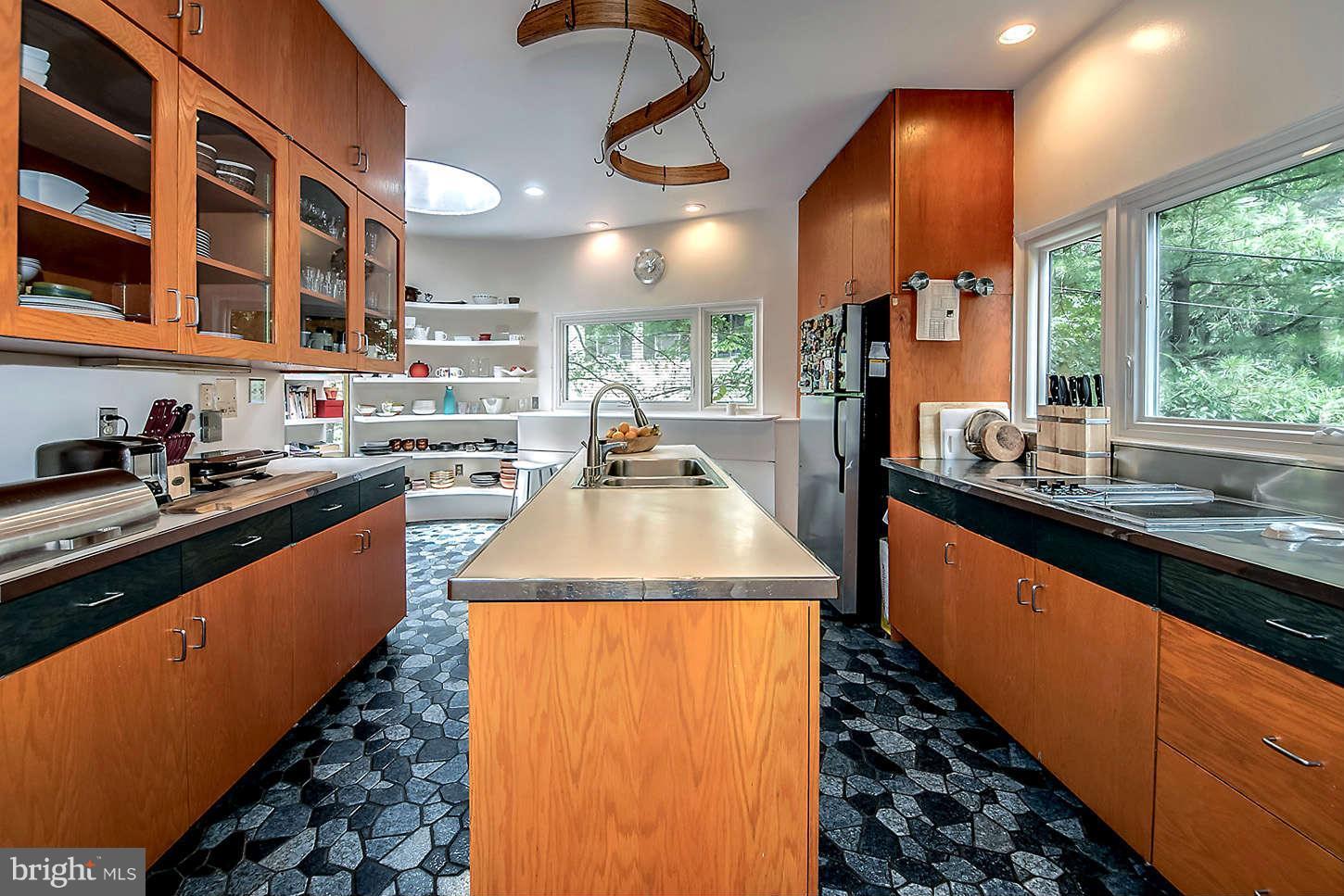 2724 Chain Bridge Road Northwest Washington, DC 20016 - Photo 20 of 30 a kitchen with stainless steel appliances granite countertop a sink and cabinets