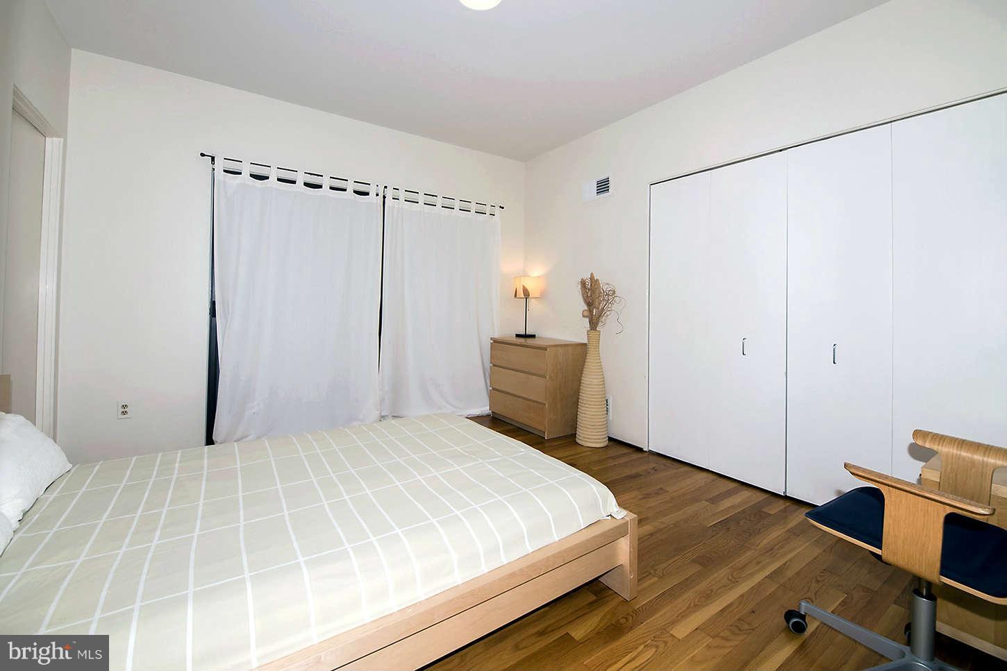 2724 Chain Bridge Road Northwest Washington, DC 20016 - Photo 21 of 30 a bedroom with a bed and a dresser