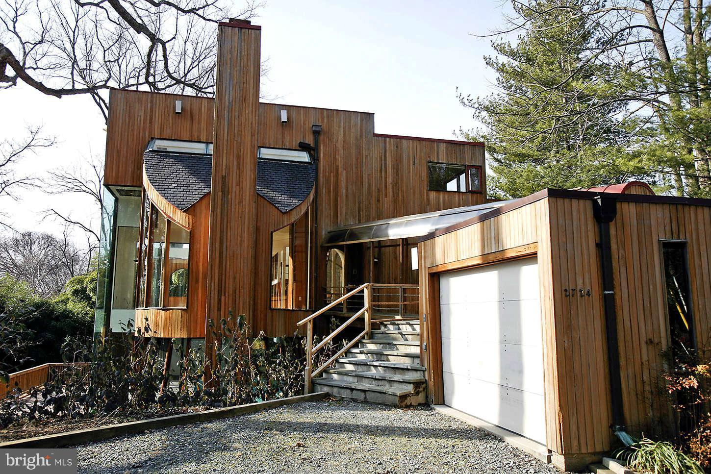 2724 Chain Bridge Road Northwest Washington, DC 20016 - Photo 5 of 30 a view of a house with a tree