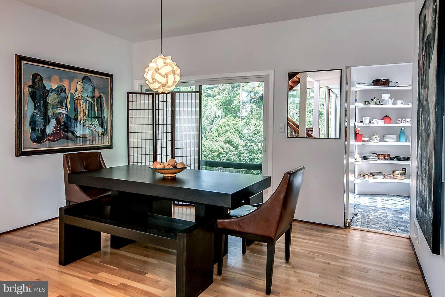 2724 Chain Bridge Road Northwest Washington, DC 20016 - Photo 9 of 30 a view of a workspace with furniture and a window