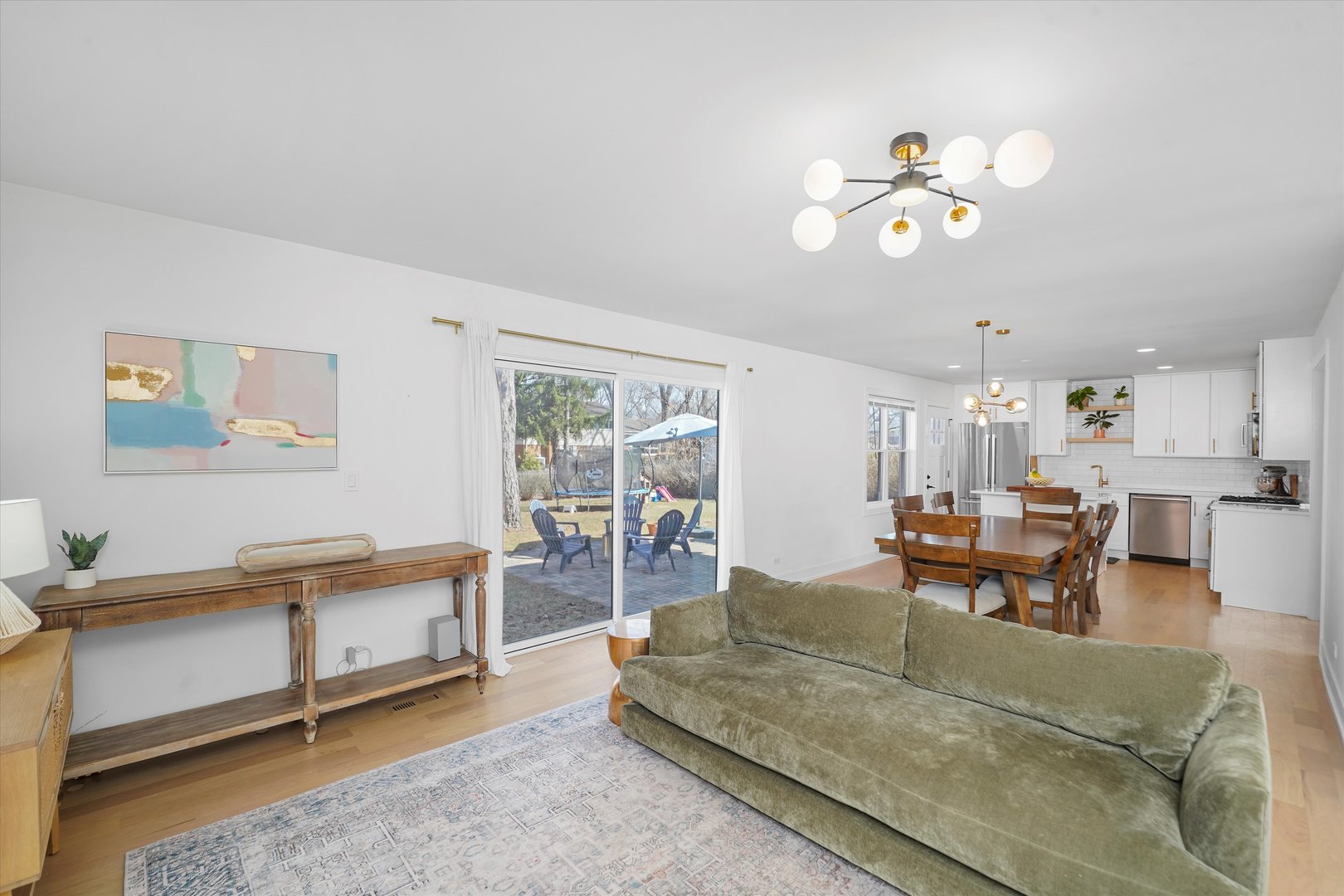 Undisclosed Address Northbrook, IL 60062 - Photo 11 of 46 a living room with furniture a dining table and a piano table
