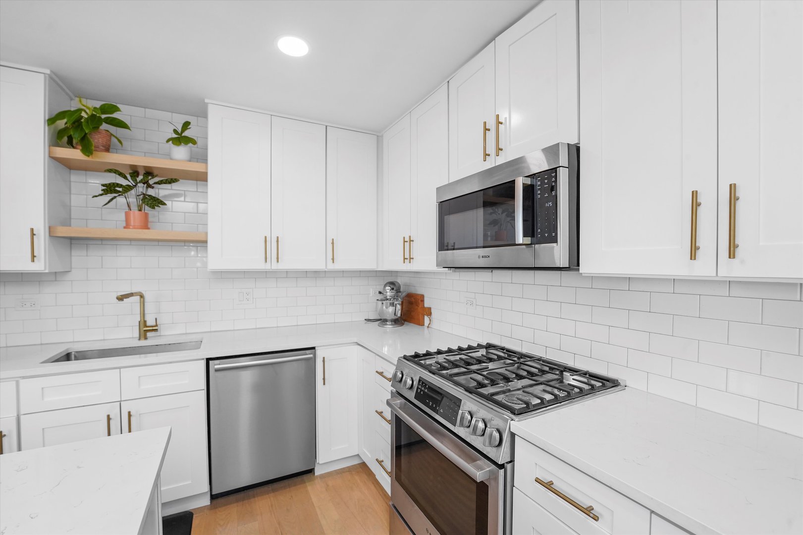 Undisclosed Address Northbrook, IL 60062 - Photo 16 of 46 a kitchen with cabinets appliances and wooden floor
