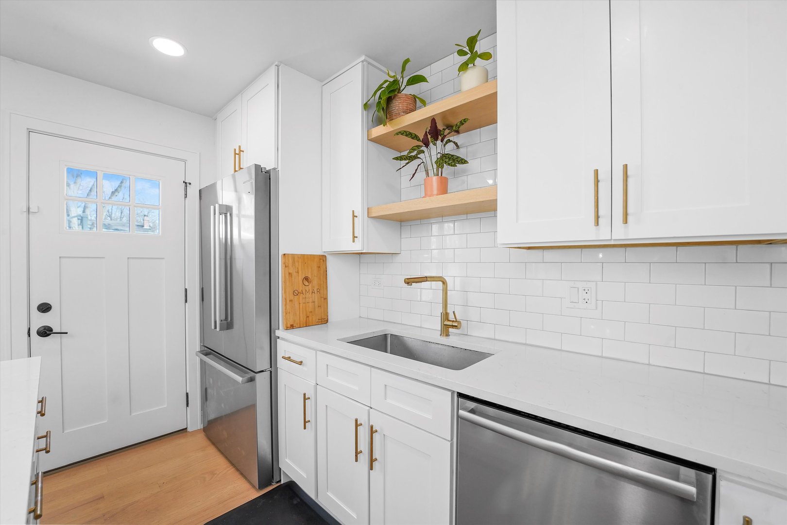 Undisclosed Address Northbrook, IL 60062 - Photo 17 of 46 a kitchen with stainless steel appliances granite countertop a sink and a refrigerator