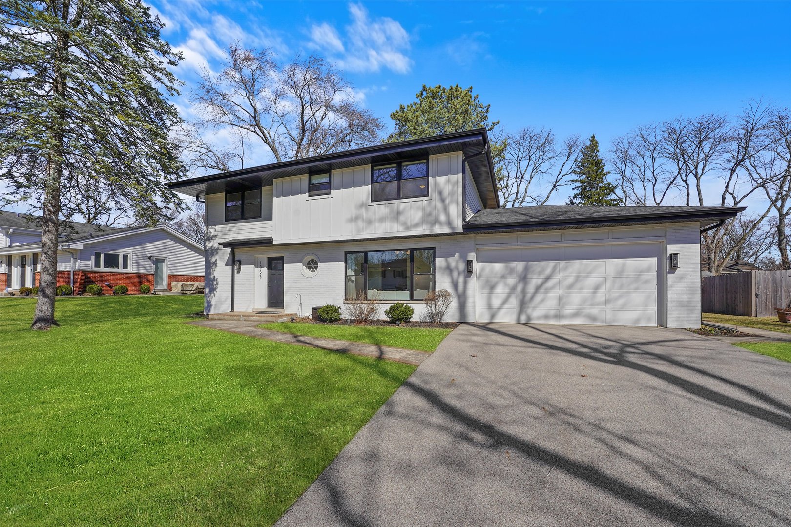 Undisclosed Address Northbrook, IL 60062 - Photo 2 of 46 a view of a house with a yard and sitting area
