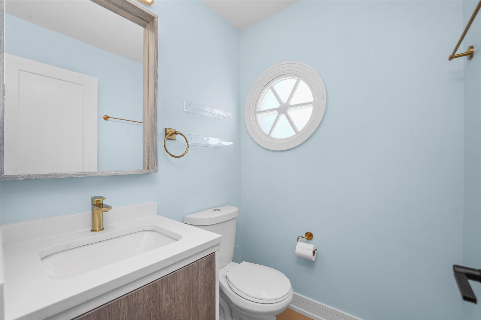 Undisclosed Address Northbrook, IL 60062 - Photo 22 of 46 a white toilet sitting next to a bathroom sink