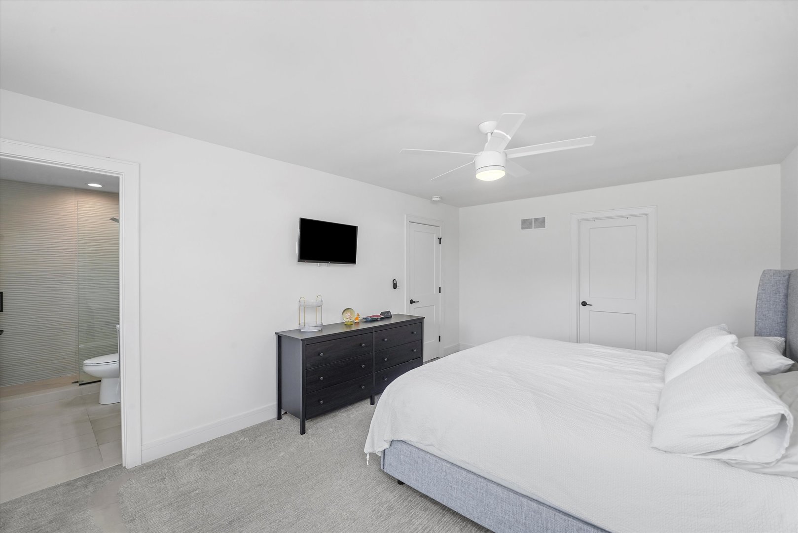 Undisclosed Address Northbrook, IL 60062 - Photo 25 of 46 a bedroom with a bed and a flat screen tv