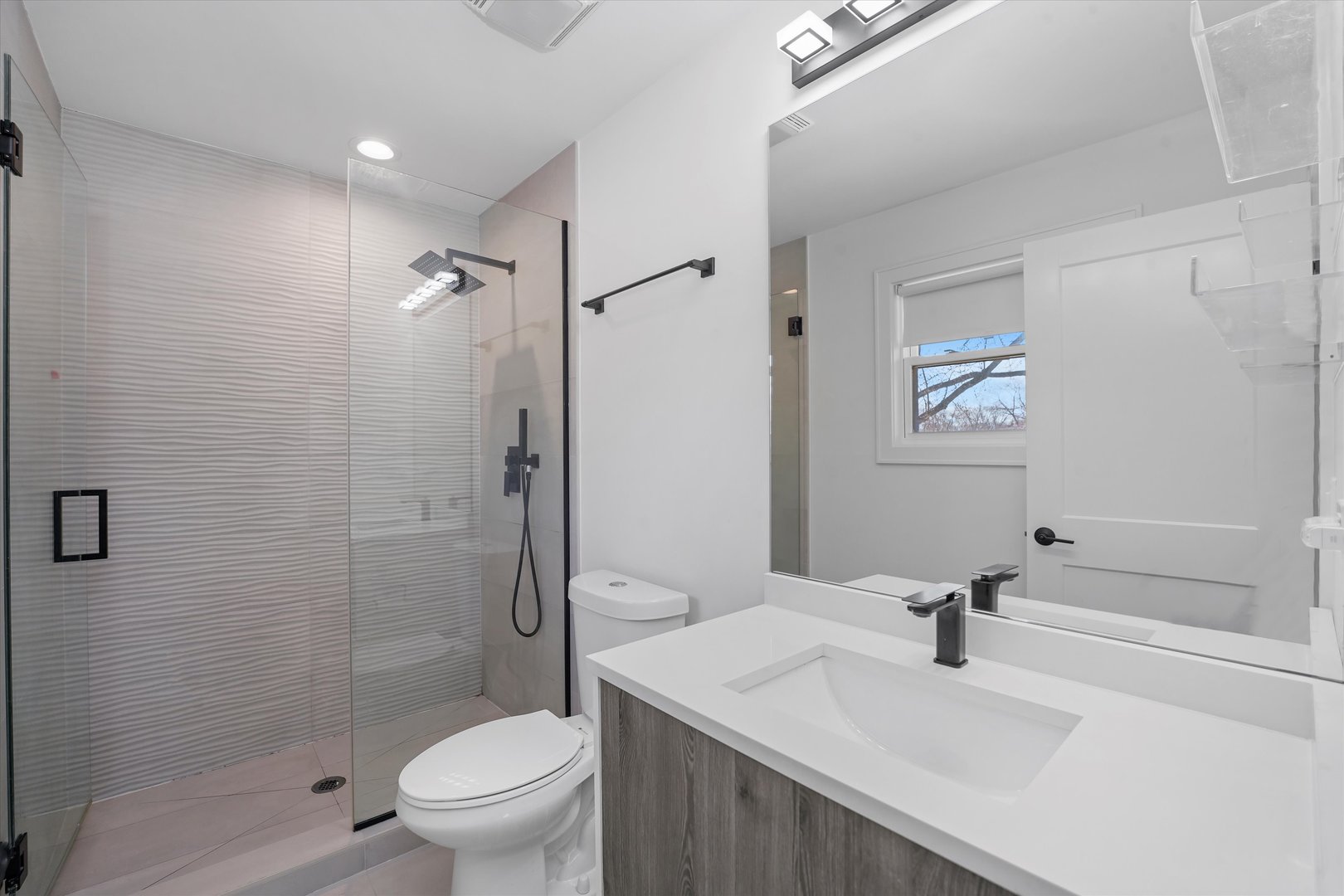 Undisclosed Address Northbrook, IL 60062 - Photo 28 of 46 a bathroom with a sink a toilet and shower