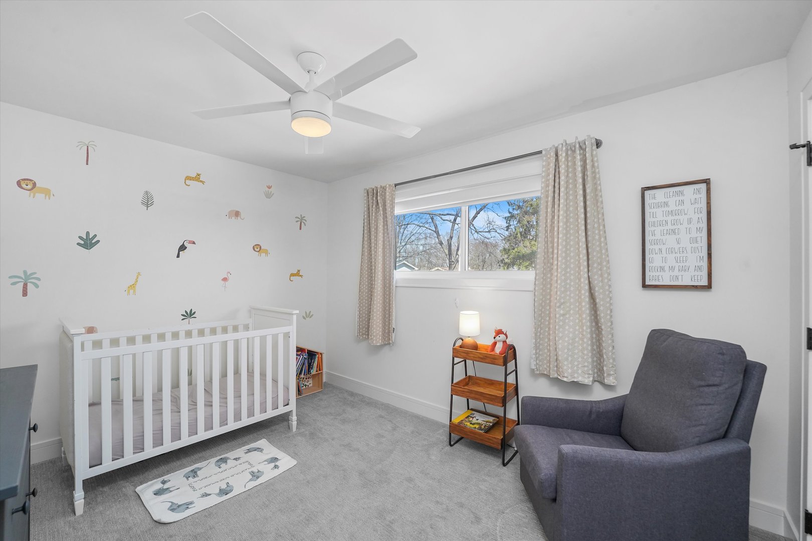 Undisclosed Address Northbrook, IL 60062 - Photo 32 of 46 a living room with furniture and a baby crib