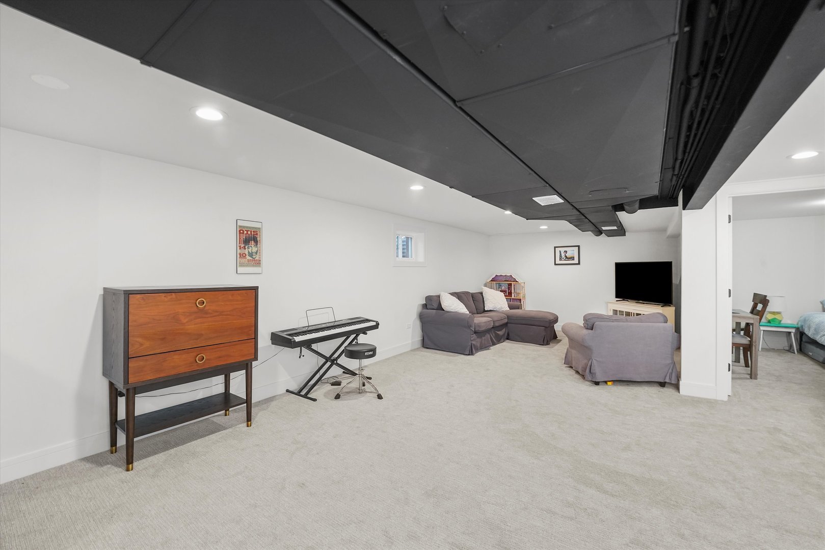 Undisclosed Address Northbrook, IL 60062 - Photo 35 of 46 a living room with furniture and a flat screen tv