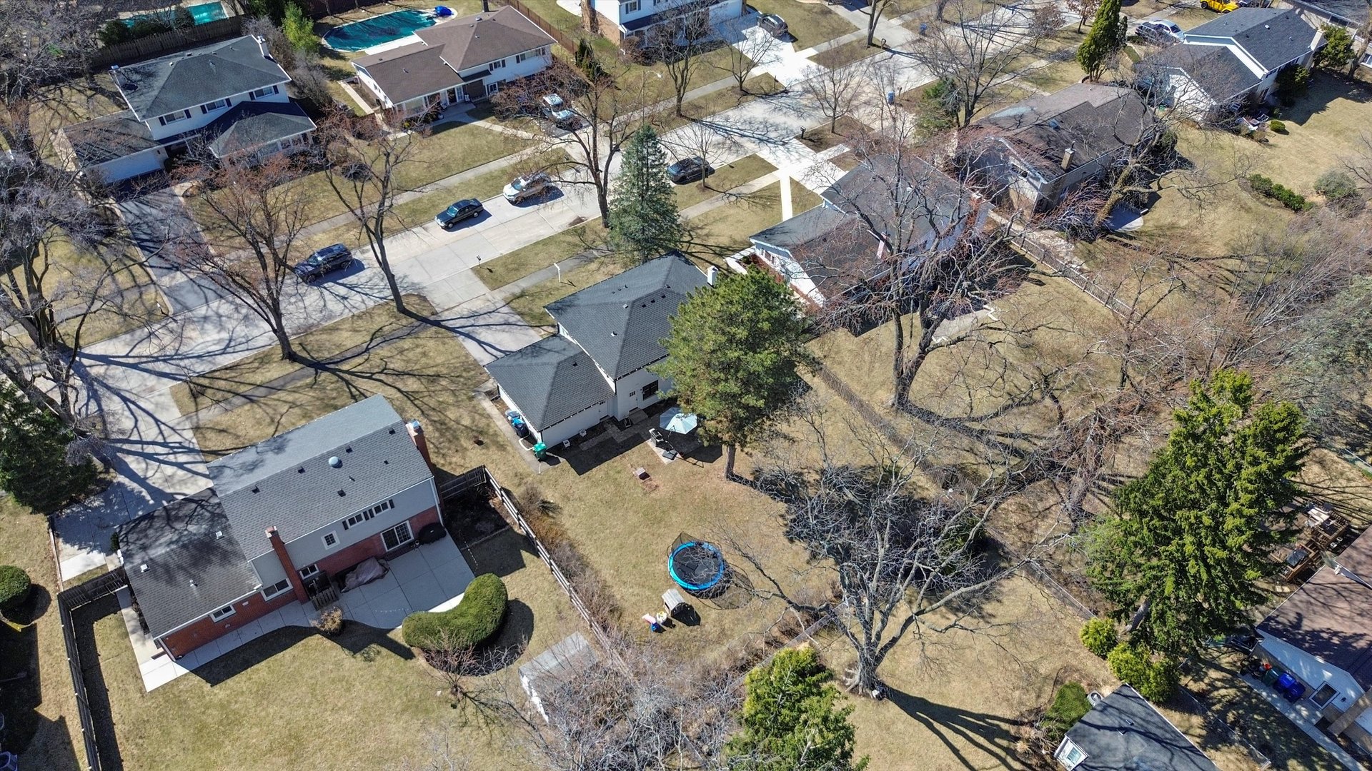 Undisclosed Address Northbrook, IL 60062 - Photo 40 of 46 an aerial view of a house with a yard and wooden fence