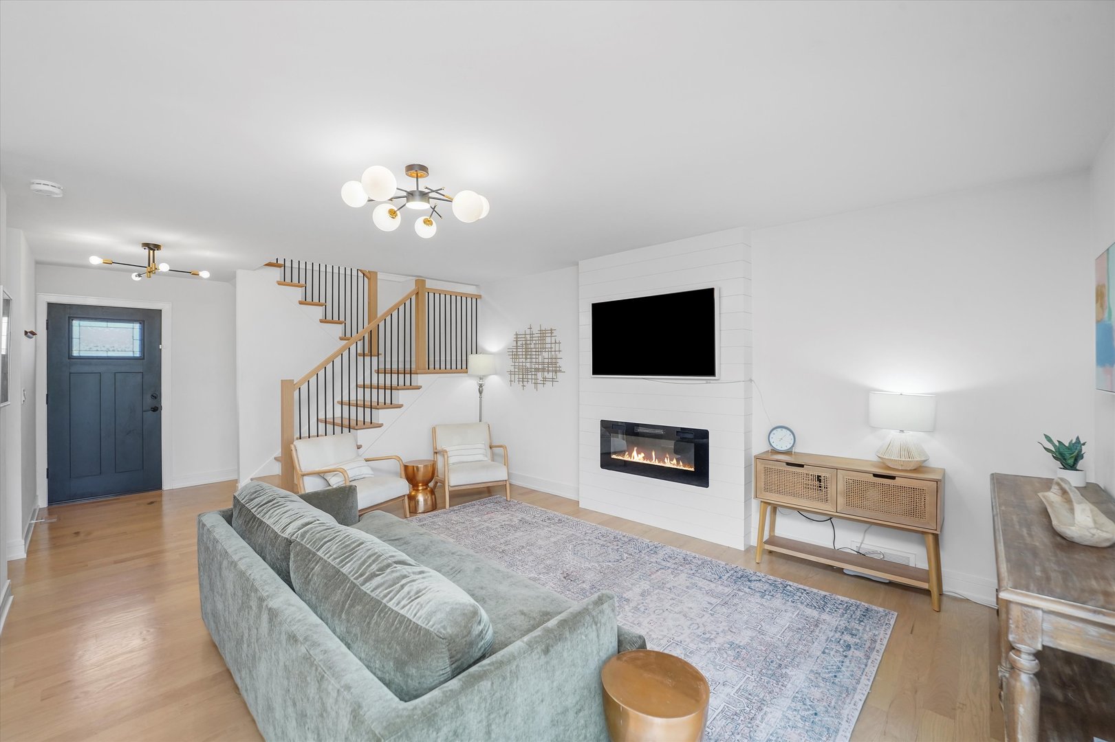 Undisclosed Address Northbrook, IL 60062 - Photo 8 of 46 a living room with furniture and a flat screen tv