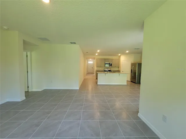 a view of a sink and a refrigerator in a bathroom