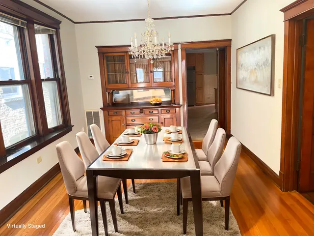 a view of a dining room with furniture and window