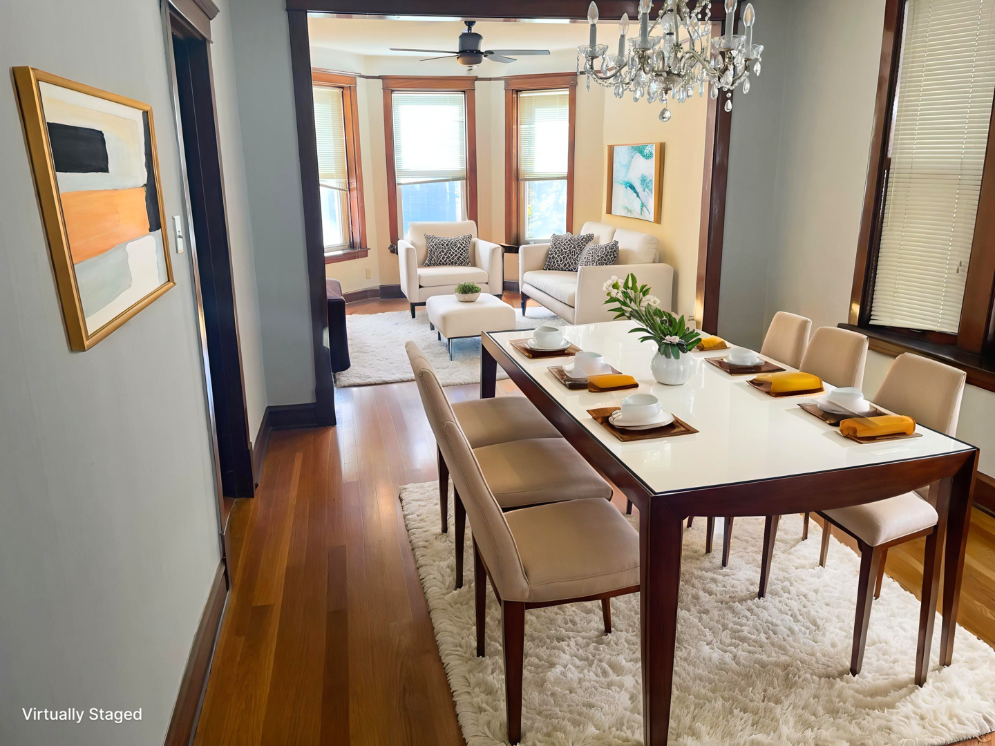 2340 West Thomas Street, Unit 2F Chicago, IL 60622 - Photo 4 of 10 a dining room with furniture a rug and a chandelier