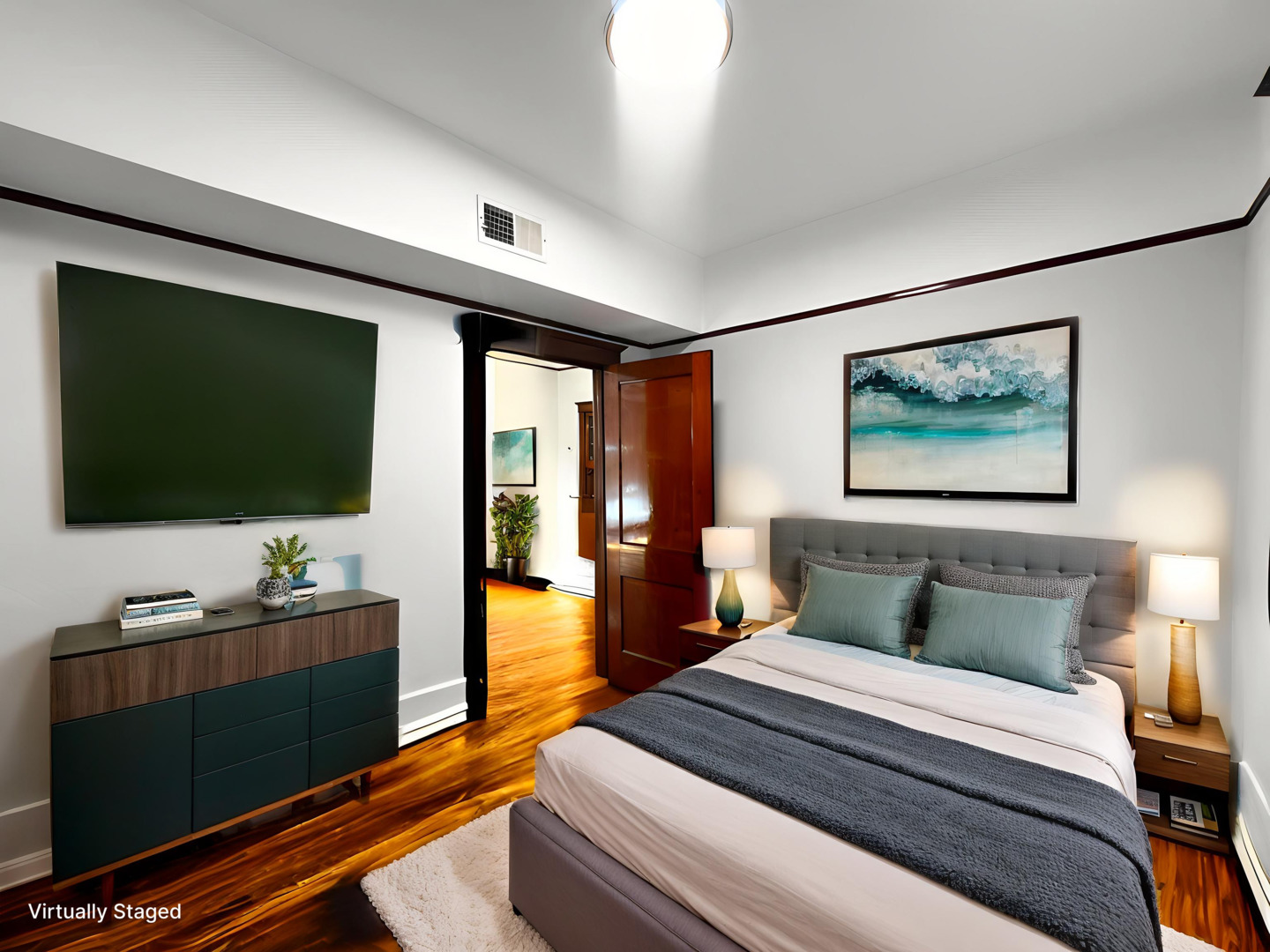 2340 West Thomas Street, Unit 2F Chicago, IL 60622 - Photo 6 of 10 a bedroom with a bed and a flat screen tv