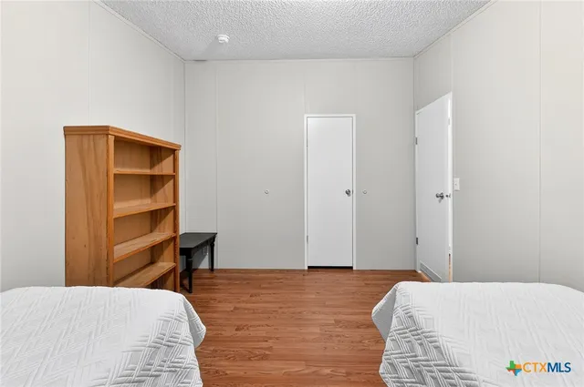 a bedroom with a bed and a cabinets