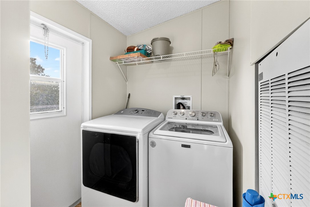 11213 Ridgewood Drive Salado, TX 76571 - Photo 21 of 24 a utility room with dryer and washer