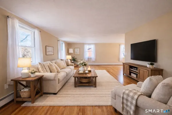 a living room with furniture and a flat screen tv