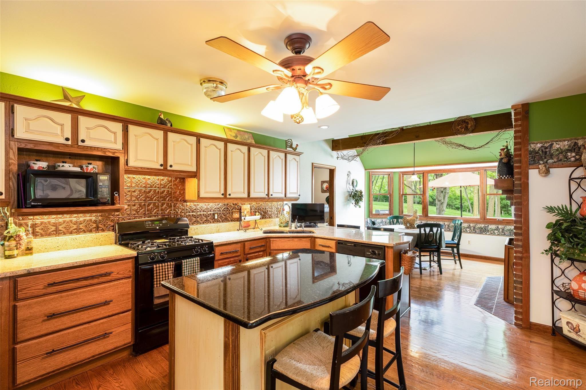 7751 Ridge Road Canton, MI 48187 - Photo 13 of 48 Granite Kitchen, Wood Floors and Abundant Cabinets