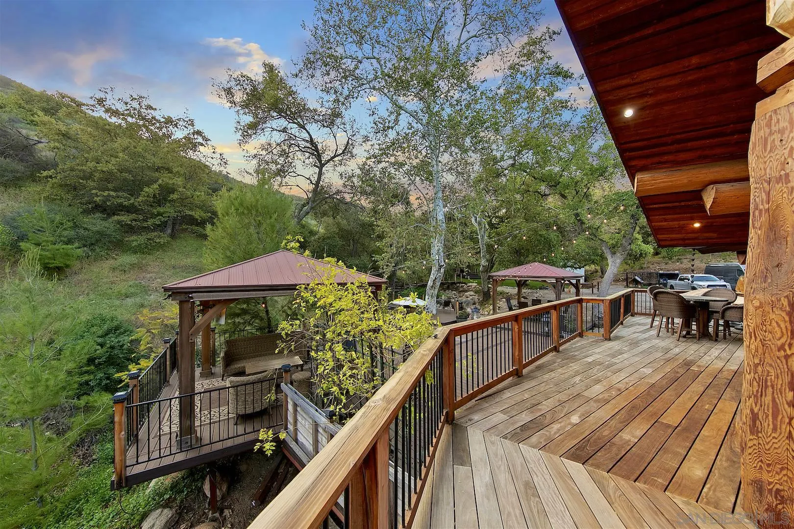 218 Frances Drive El Cajon, CA 92019 - Photo 11 of 56 a balcony with wooden floor and outdoor seating