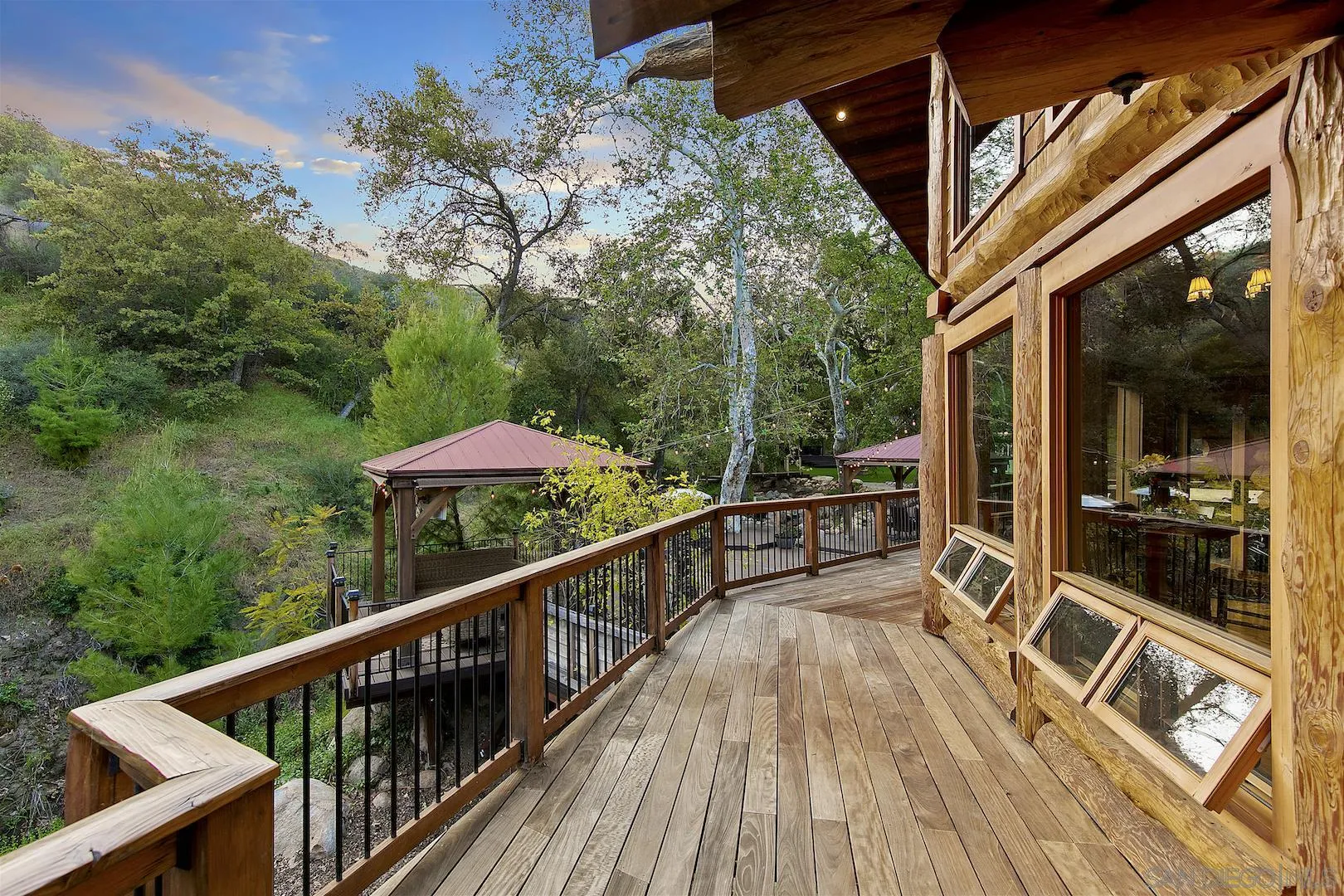 218 Frances Drive El Cajon, CA 92019 - Photo 15 of 56 a balcony with wooden floor and outdoor seating