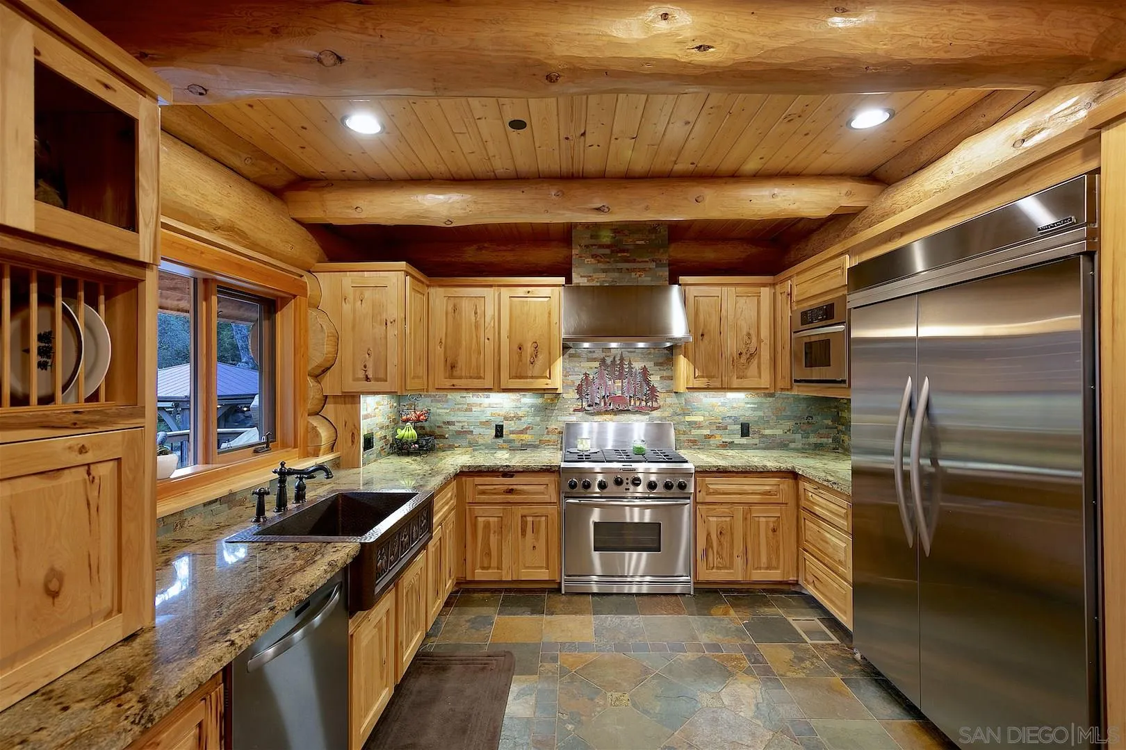 218 Frances Drive El Cajon, CA 92019 - Photo 24 of 56 a kitchen with stainless steel appliances granite countertop a sink a stove and a refrigerator