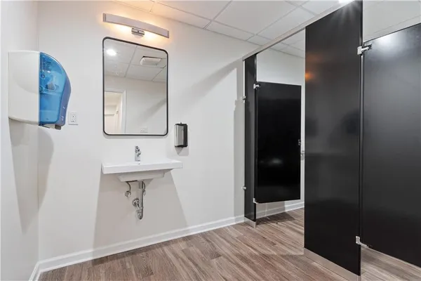 a bathroom with a sink and mirror