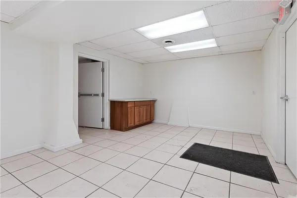 a view of an empty room and wooden floor