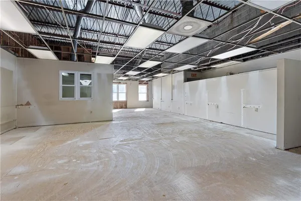 a view of a room with wooden walls