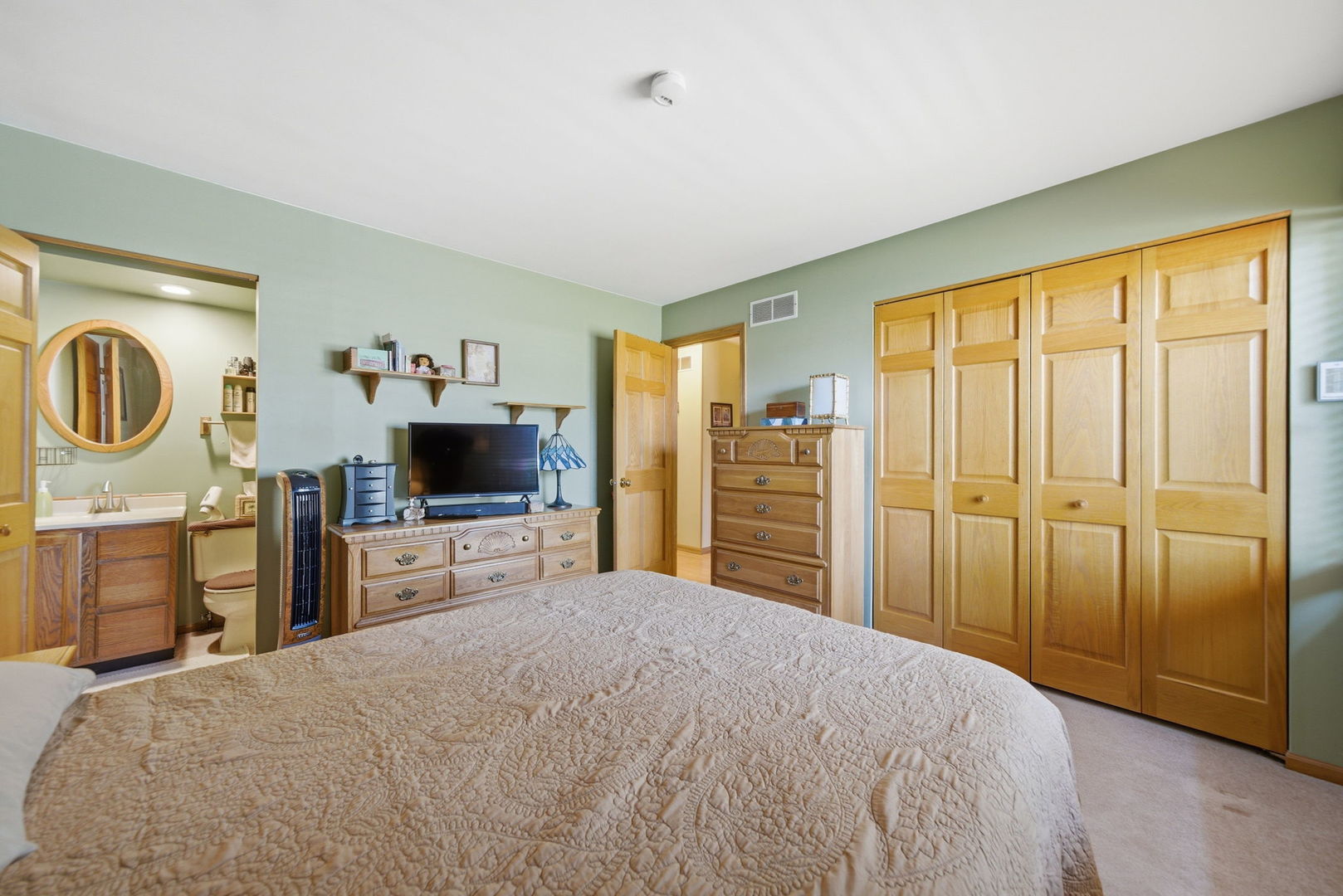1839 Kerrybrook Court Sycamore, IL 60178 - Photo 11 of 25 a bedroom with a bed and a flat tv screen in it