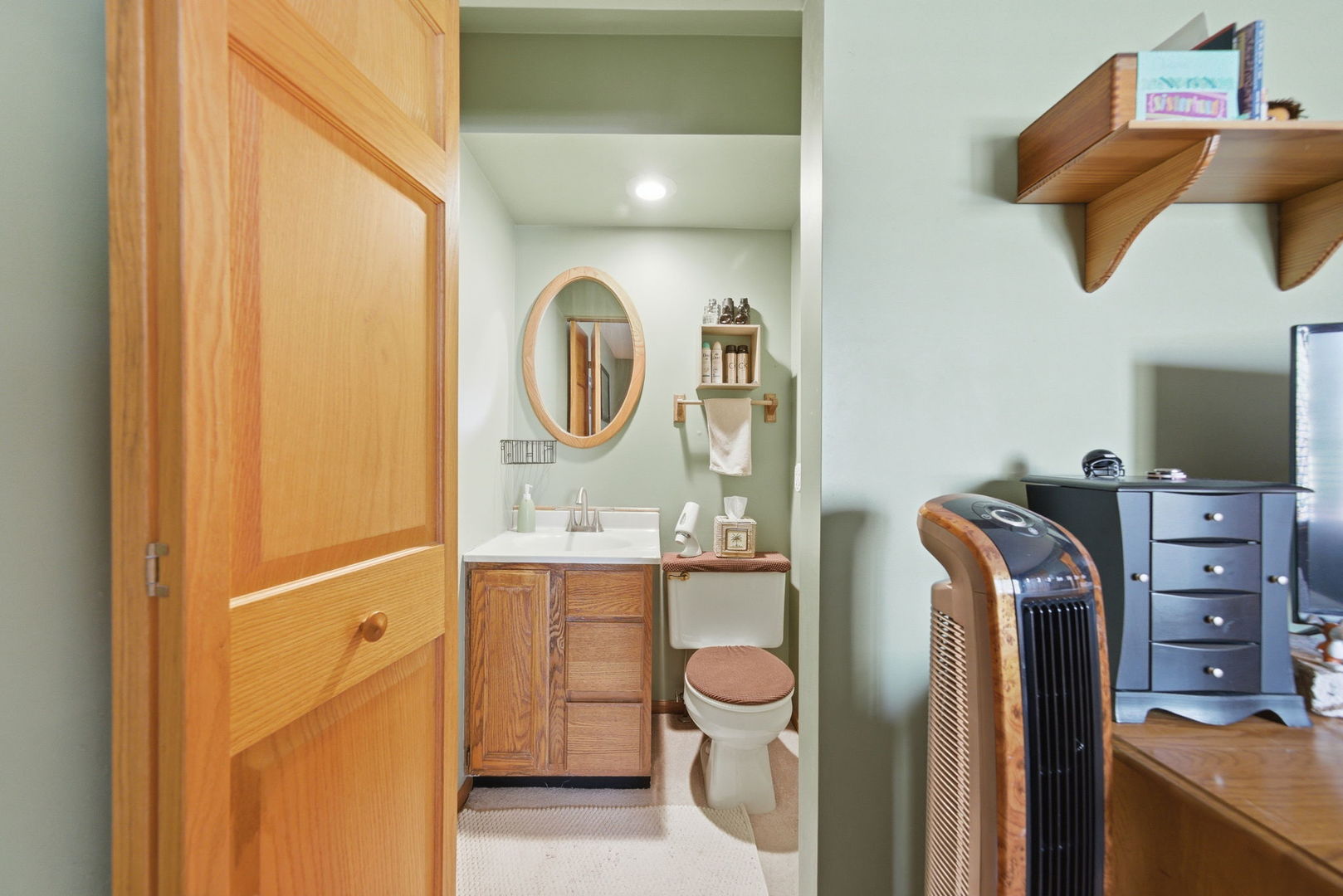 1839 Kerrybrook Court Sycamore, IL 60178 - Photo 12 of 25 a bathroom with a sink a mirror and shower
