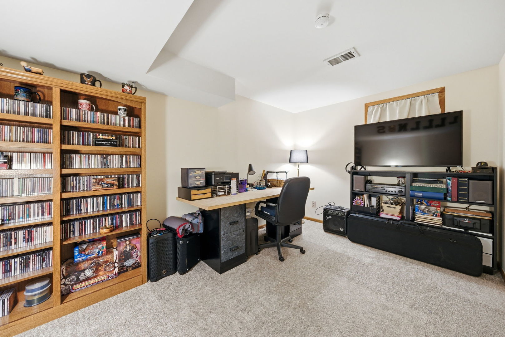 1839 Kerrybrook Court Sycamore, IL 60178 - Photo 21 of 25 a living room with furniture and a flat screen tv