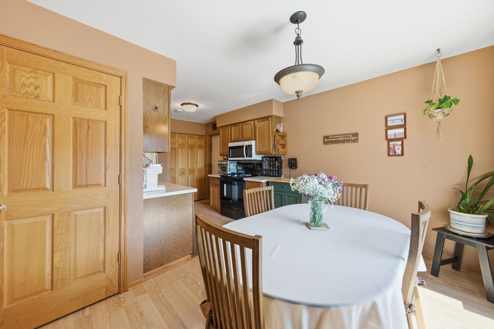 1839 Kerrybrook Court Sycamore, IL 60178 - Photo 6 of 25 a view of a dining room with furniture and wooden floor
