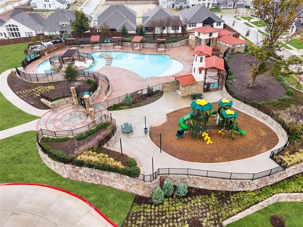 1340 Cartona Road Fate, TX 75087 - Photo 29 of 32 a view of a swimming pool with a chairs