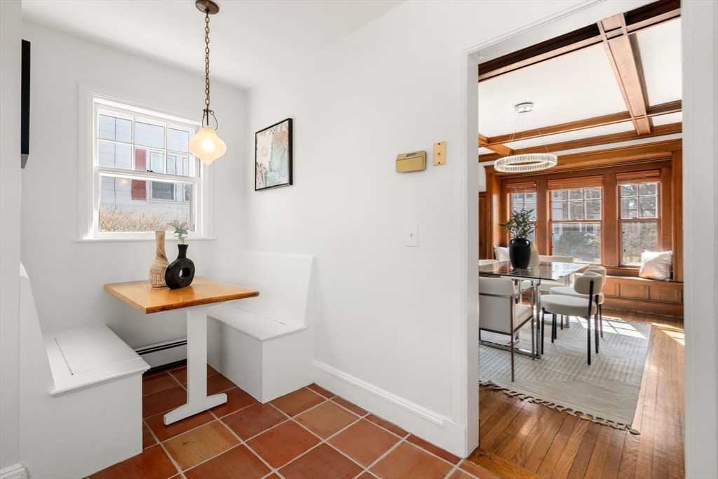 65 Bothfeld Road Newton, MA 02459 - Photo 11 of 31 a living room with furniture a dining table and a chandelier
