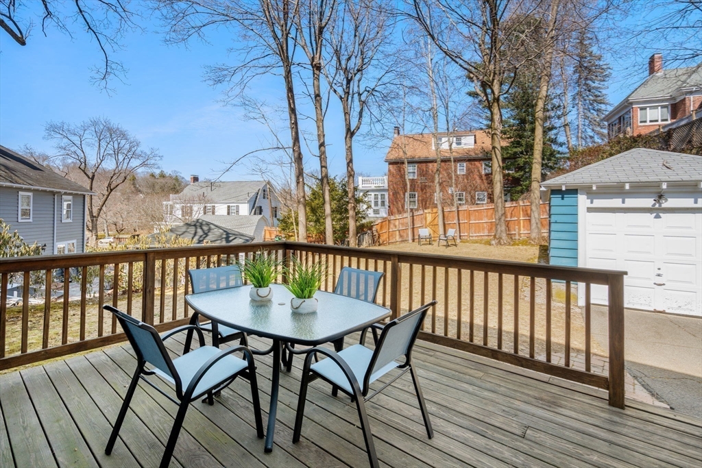 65 Bothfeld Road Newton, MA 02459 - Photo 26 of 31 a view of a chairs on wooden deck
