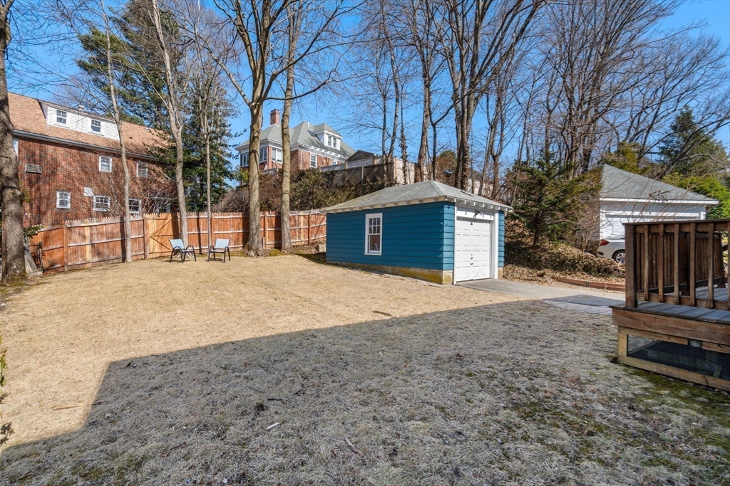 65 Bothfeld Road Newton, MA 02459 - Photo 28 of 31 a front view of a house with a yard covered with snow