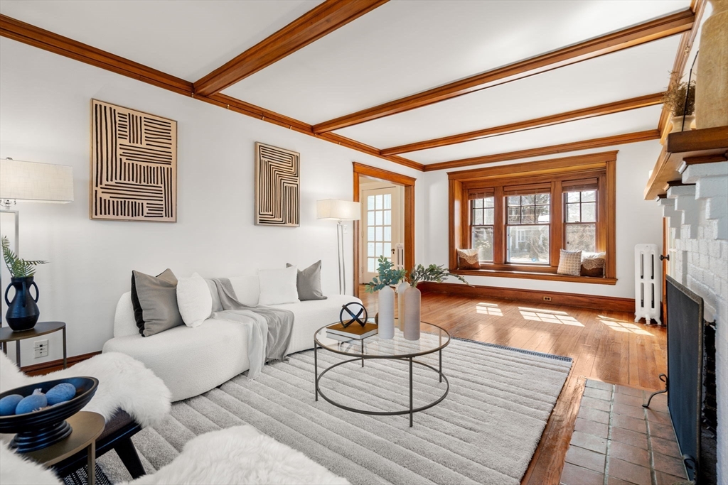 65 Bothfeld Road Newton, MA 02459 - Photo 6 of 31 a living room with furniture and a floor to ceiling window