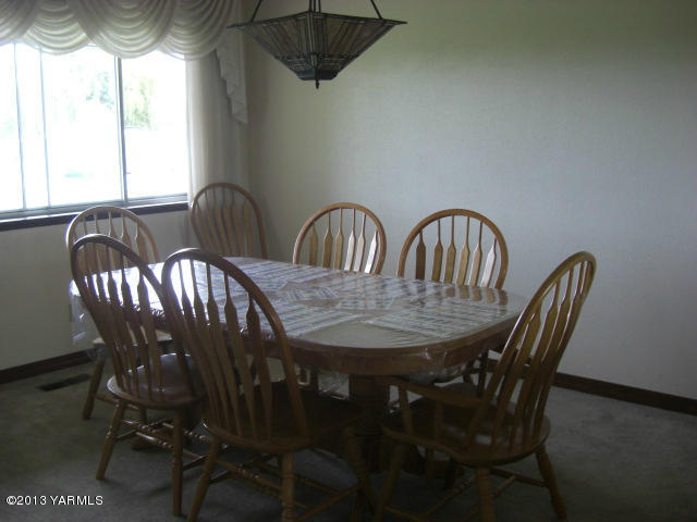 13907 Fisk Road Yakima, WA 98908 - Photo 17 of 55 a view of a dining room with furniture and window